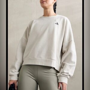 Adidas women's cropped sweatshirt, size M,cream color, relaxed style